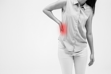 Woman holding side in pain